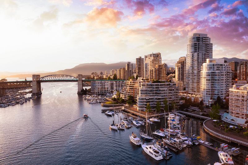 Aerial View of Downtown Vancouver, Coal Harbour and Stanley Park. Taken during a bright sunny morning in British Columbia, Canada. Modern Cityscape from above.
